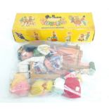 A boxed Pelham clown string puppet and two other Pelham string puppets of girls,