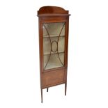 An Edwardian mahogany floor standing corner display unit with string inlay, shaped gallery,