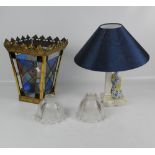 A stained leaded glass tapering lantern light shade with brass frame with hanging chain,