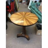 A 19th century circular tilt top occasional table with radially veneered specimen wood top,