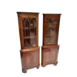 A reproduction bowfronted free standing corner cupboard and reproduction flat fronted mahogany free