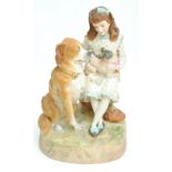 A tinted bisque figure group of a girl with a pug dog on her knee with a further large dog,