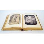 A late 19th/early 20th century album of reproduced black and white photographs relating in the