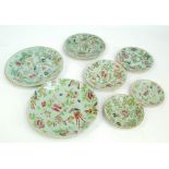 Seven Chinese Export Canton Famille Rose celadon glazed plates in various sizes, the largest 25.