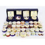 A large collection of Crummles enamel lidded boxes including royal commemorative examples,