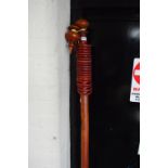 A Victorian mahogany curtain pole with pointed shaped finials, length 183cm, with 19 rings.