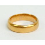 A 22ct yellow gold wedding band, size K, approx 6.9g.