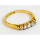 An 18ct yellow gold diamond ring with five graduated small stones, size K 1/2, approx 2.3g.