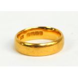 A 22ct yellow gold wedding band, size I, approx 5.6g.