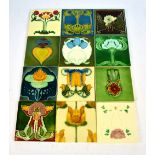 A group of twelve Art Nouveau stylised floral decorated square section tiles,