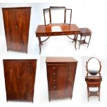 A reproduction mahogany bedroom suite, comprising two twin door wardrobes,