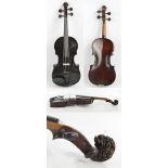 A full size German violin with carved scroll and two-piece back, unlabelled,