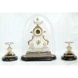 A late 19th century French alabaster gilt metal mounted three piece clock garniture,