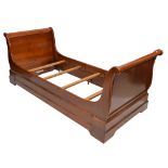 A reproduction French single sleigh bed.