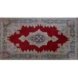 A Persian Kirman rug, 234 x 148cm.