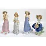 Four Lladro figures of girls including one holding a basket of flowers, tallest height 21cm (4).