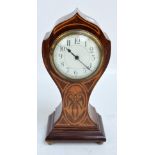 An Edwardian mahogany and inlaid mantel timepiece with circular dial set with Arabic numerals and