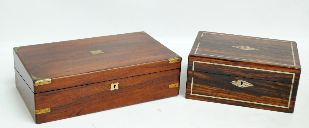 A late 19th century rosewood brass bound writing slope with inkwell and pen tray to the interior,