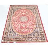 A red ground Keshan carpet, 280 x 200cm.