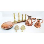 A group of metalware comprising two pairs of brass candlesticks, two iron stands,