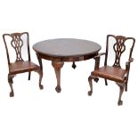 A mahogany dining table with D-ends, three extension leaves, gadrooned rim,