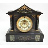 A late 19th century American Ansonia black slate mantel clock with gilt heightened decoration and