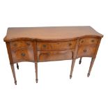 A reproduction mahogany and crossbanded serpentine sideboard, width 151cm.