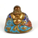 A Chinese late Qianlong/early Jiaqing gilt hollow metal and enamel detailed figure of a seated