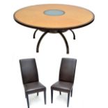 A large reproduction bird's eye maple veneered and crossbanded circular dining table with glass