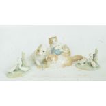 Four Nao animal figures; two cats, one with a ball of wool and two goose groups,