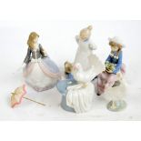 Three Lladro figures; a seated girl with flowers,