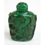 An early 19th century carved malachite snuff bottle decorated with birds amongst blossoming