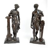 AFTER DUMAIGE; a large pair of decorative bronze classical figures,