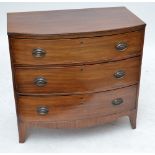 A 19th century bowfronted chest of three long graduated drawers raised on splayed bracket feet,