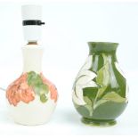 MOORCROFT; A "Hibiscus" pattern tube lined decorated bottle vase baluster lamp base on cream ground,