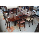 An early 19th century mahogany and ebony strung pull-out dining table on turned legs to castor feet,