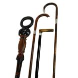 Three hallmarked silver mounted walking sticks to include ebonised horn handled example,