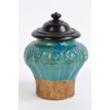 A Chinese late Ming Provincial ceramic baluster jar with turquoise glazed footed and mould scroll