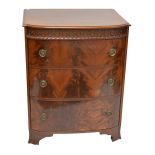 A mahogany bowfronted three drawer chest, formerly the centre section from a compactum wardrobe,