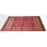 A red ground Bokhara carpet, 230 x 160cm.