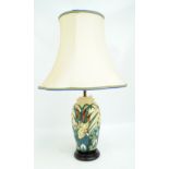 MOORCROFT; A "Lamia" pattern tube lined decorated baluster lamp base on yellow ground,