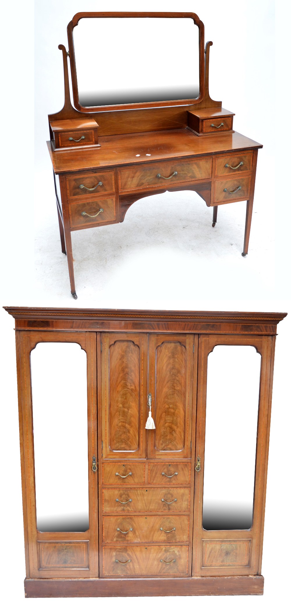 An Edwardian mahogany and inlaid mirrored wardrobe with matching dressing table (2).