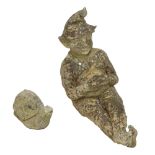 A reconstituted stone gnome, modelled seated. length approx 52cm and a snail (2).