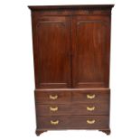 A 19th century mahogany wardrobe converted from a linen press with two upper cupboard doors above
