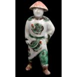 A 19th century Chinese Famille Verte porcelain joss stick/incense holder modelled as a figure of a