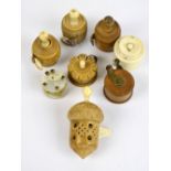 Eight late 19th century/early 20th century tape measures; four with vegetable ivory bodies,