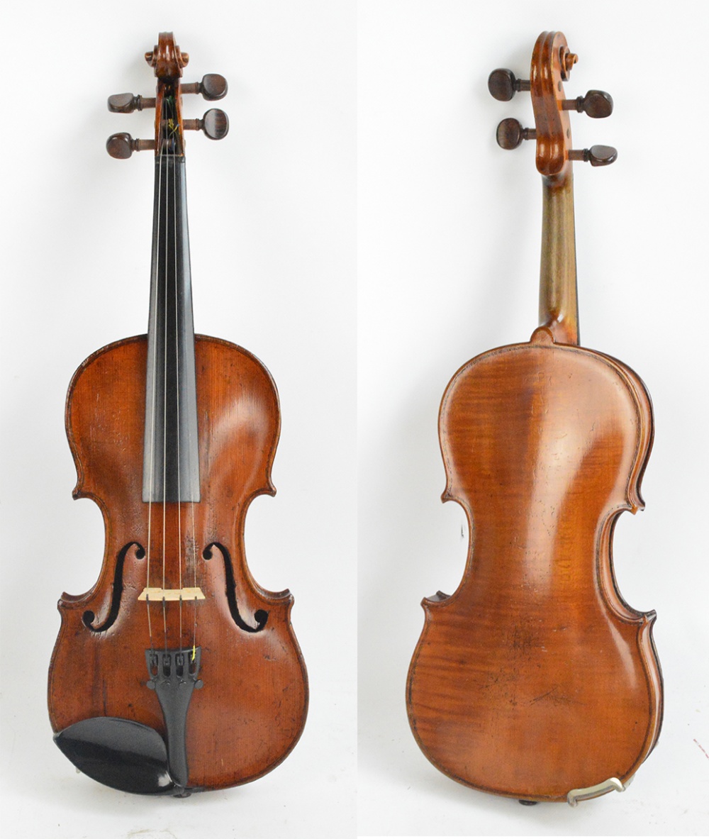 A German three quarter size violin, unlabelled, the one-piece back 32.5cm.