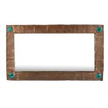 An Arts and Crafts beaten copper rectangular wall mirror with four green/blue enamel roundles to