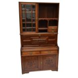 A Victorian mahogany display cabinet/writing desk with upper shelving, two small drawers,