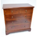 An Edwardian mahogany inlaid chest of two short and three long graduated drawers raised on bracket